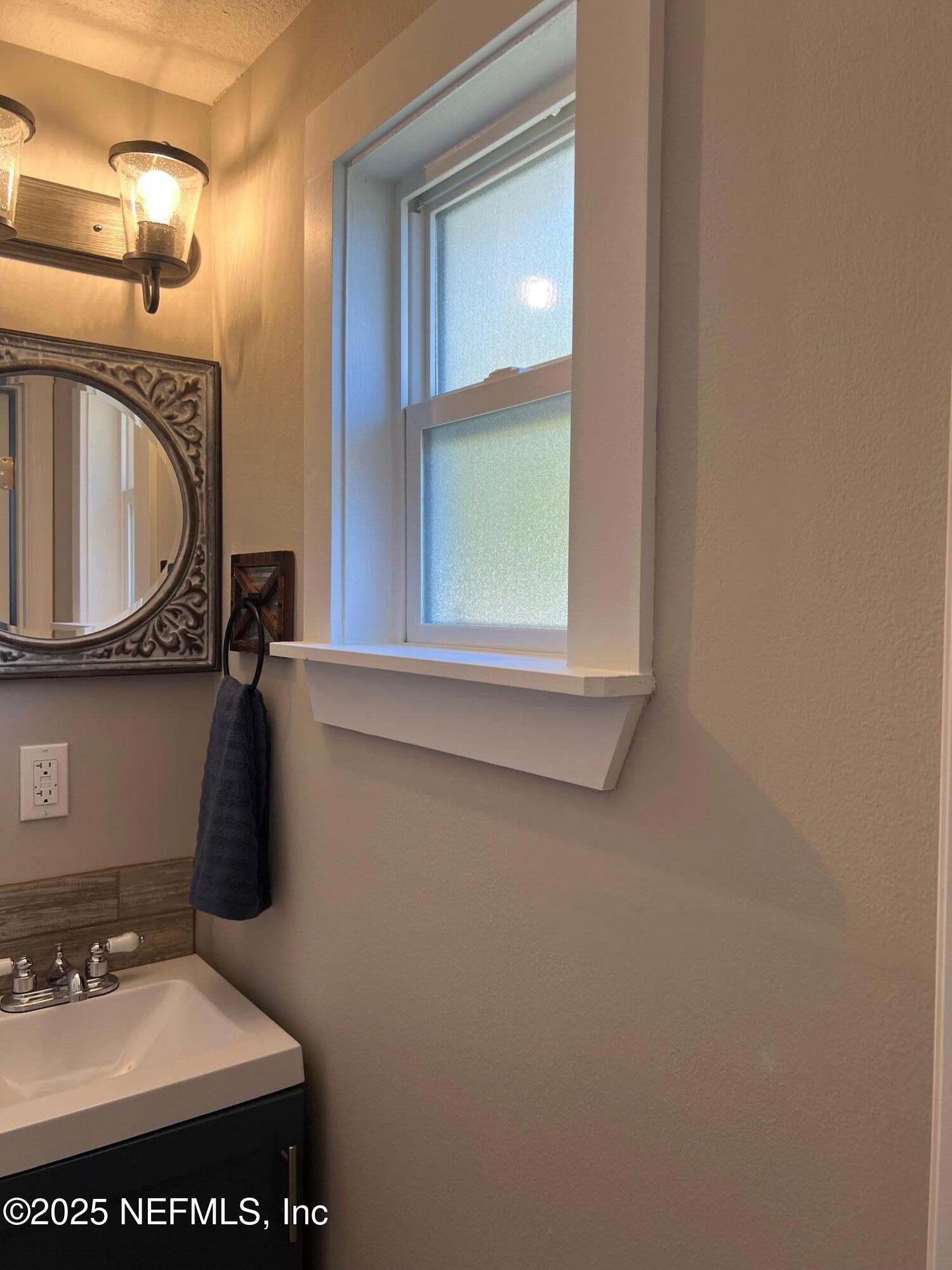 205 Noel Road Orange Park, FL 32073 - Photo 35 of 84 a bathroom with a sink and a mirror