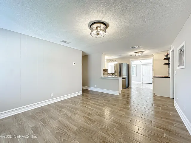 a view of a backyard with sitting area