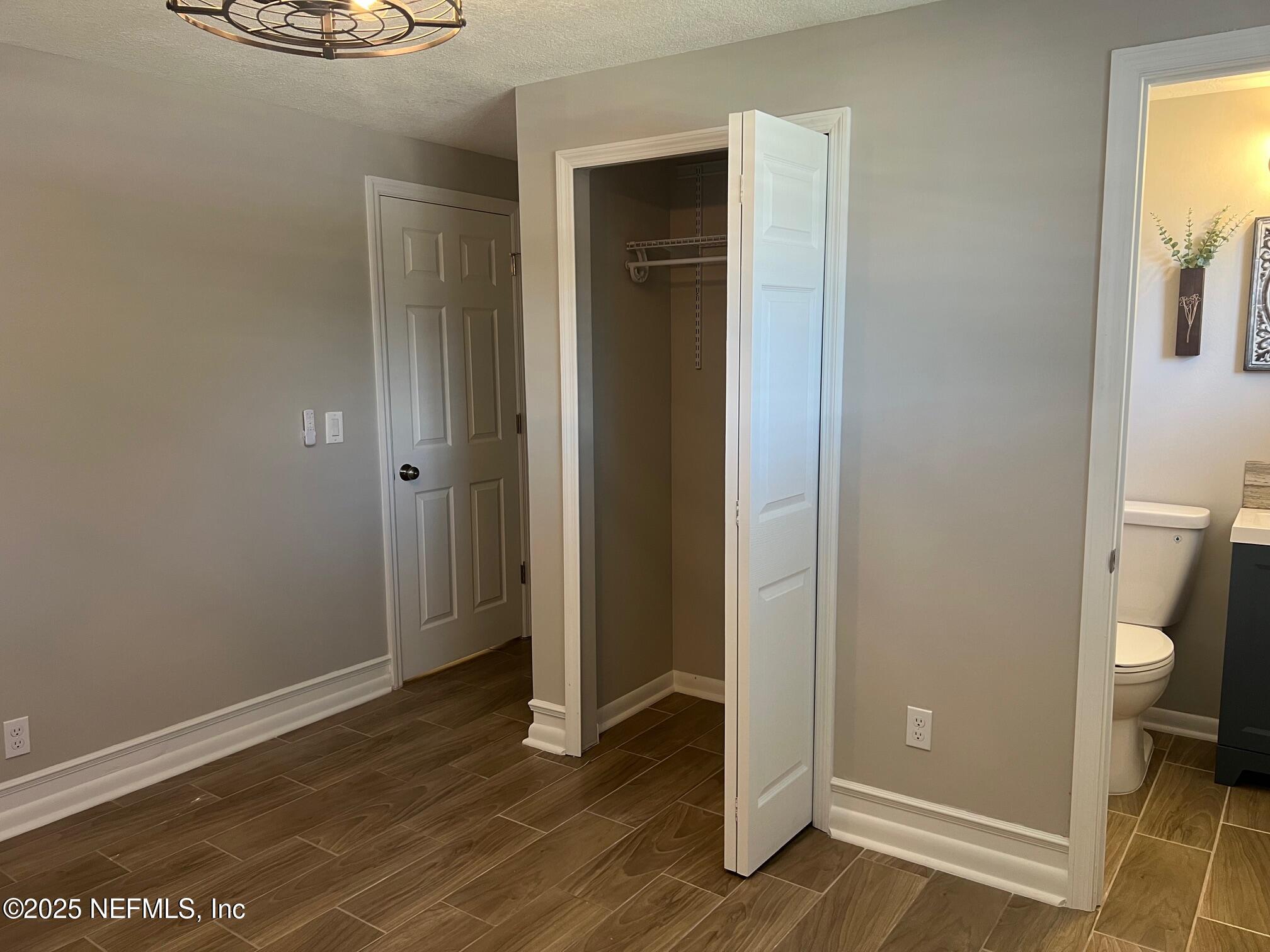 205 Noel Road Orange Park, FL 32073 - Photo 59 of 84 an empty room with wooden floor and a window
