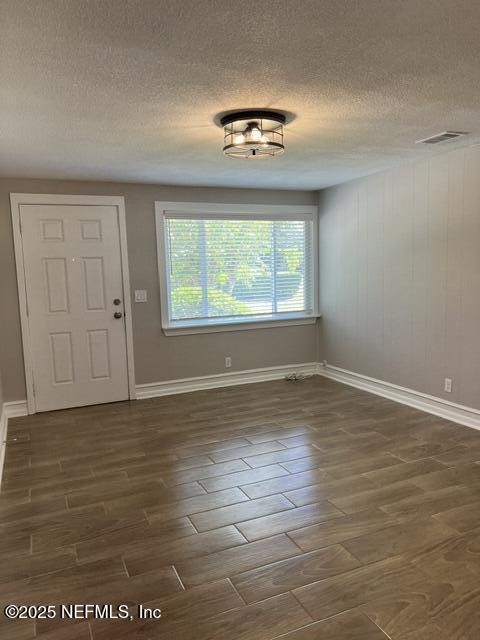 205 Noel Road Orange Park, FL 32073 - Photo 65 of 84 an empty room with wooden floor chandelier and windows