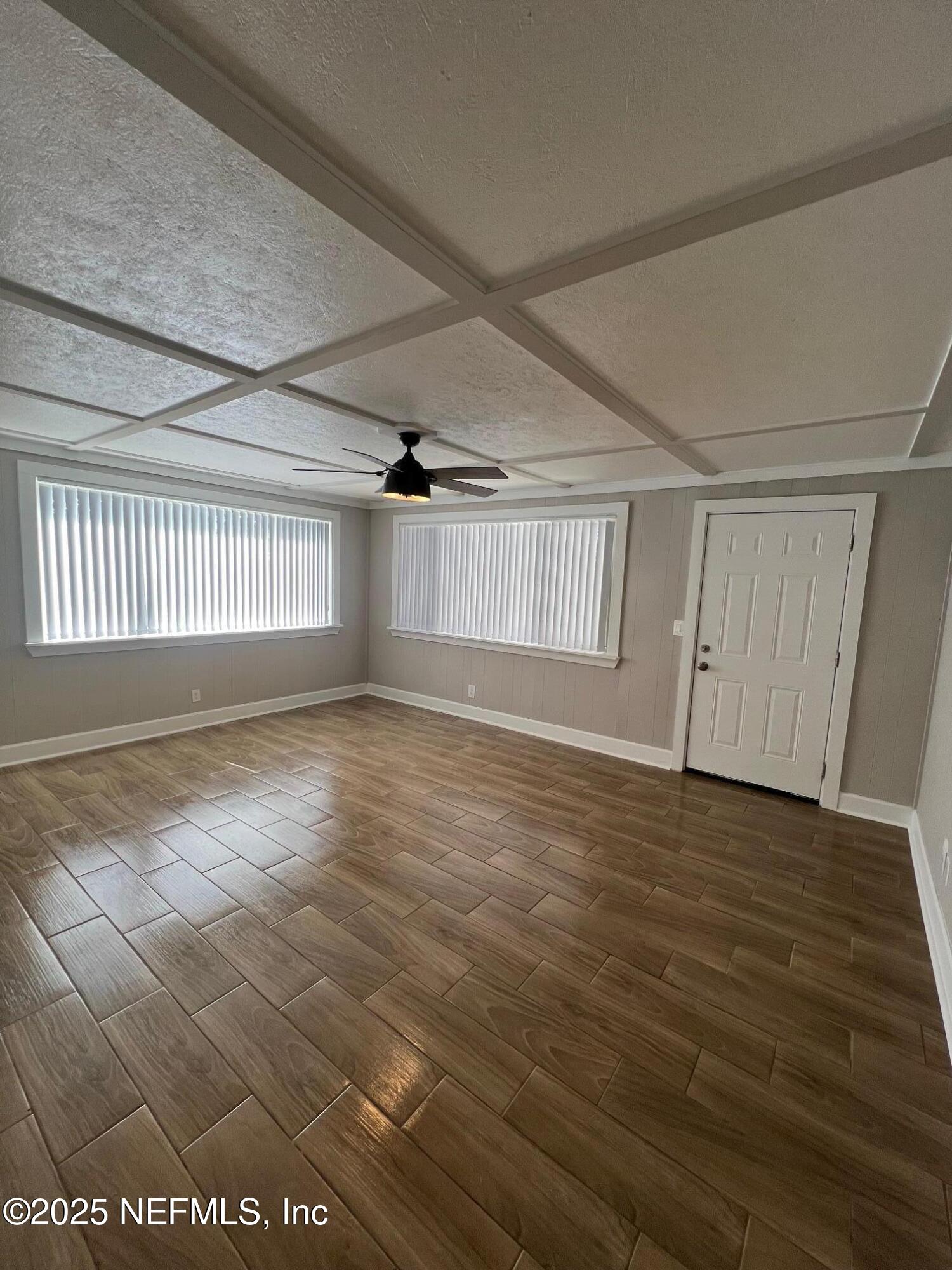 205 Noel Road Orange Park, FL 32073 - Photo 71 of 84 an empty room with wooden floor and windows