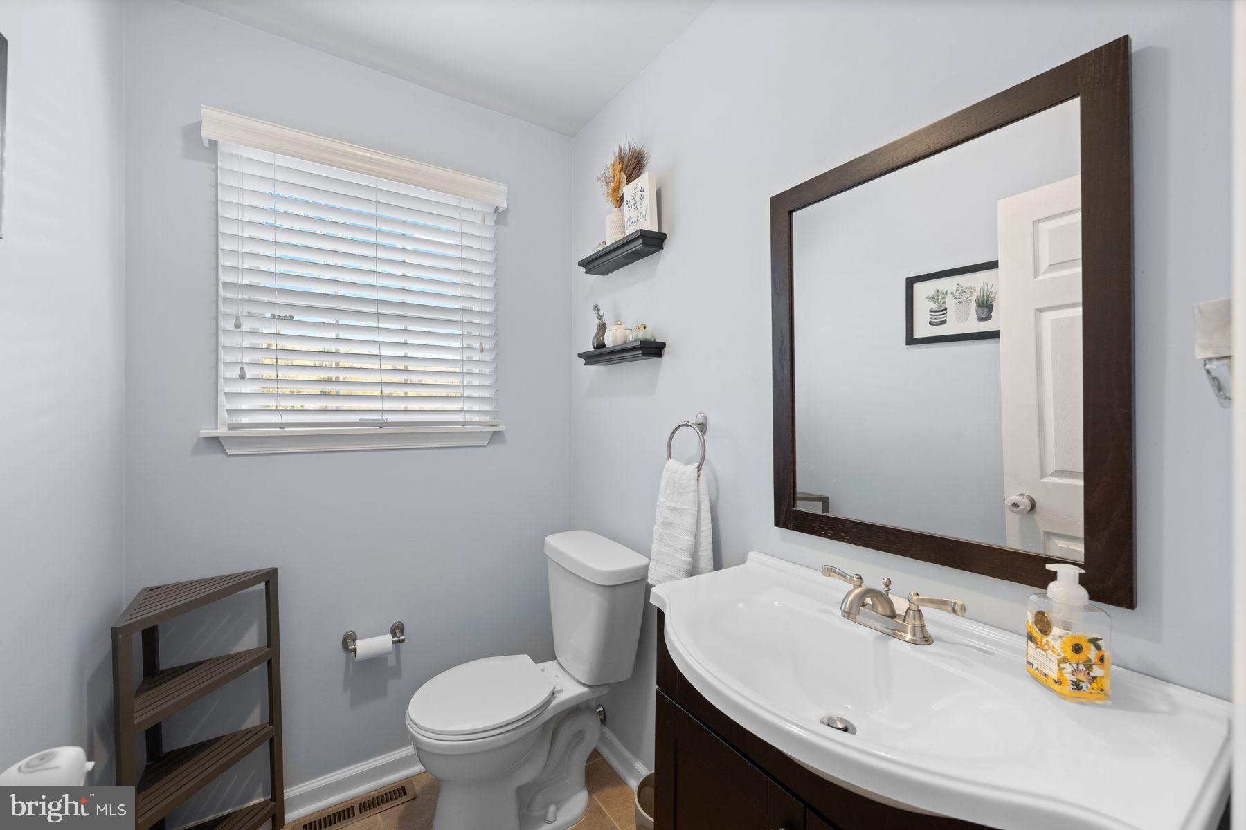 188 Arden Road Conshohocken, PA 19428 - Photo 16 of 39 a bathroom with a sink toilet and mirror
