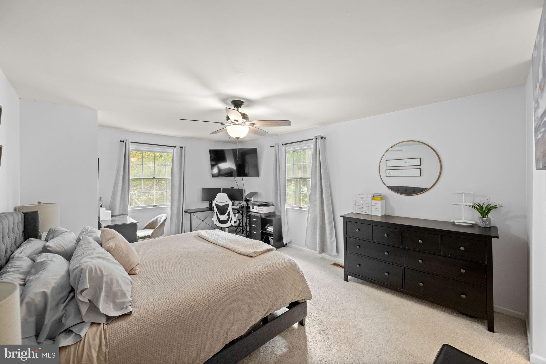 188 Arden Road Conshohocken, PA 19428 - Photo 19 of 39 a bedroom with a bed and a chandelier
