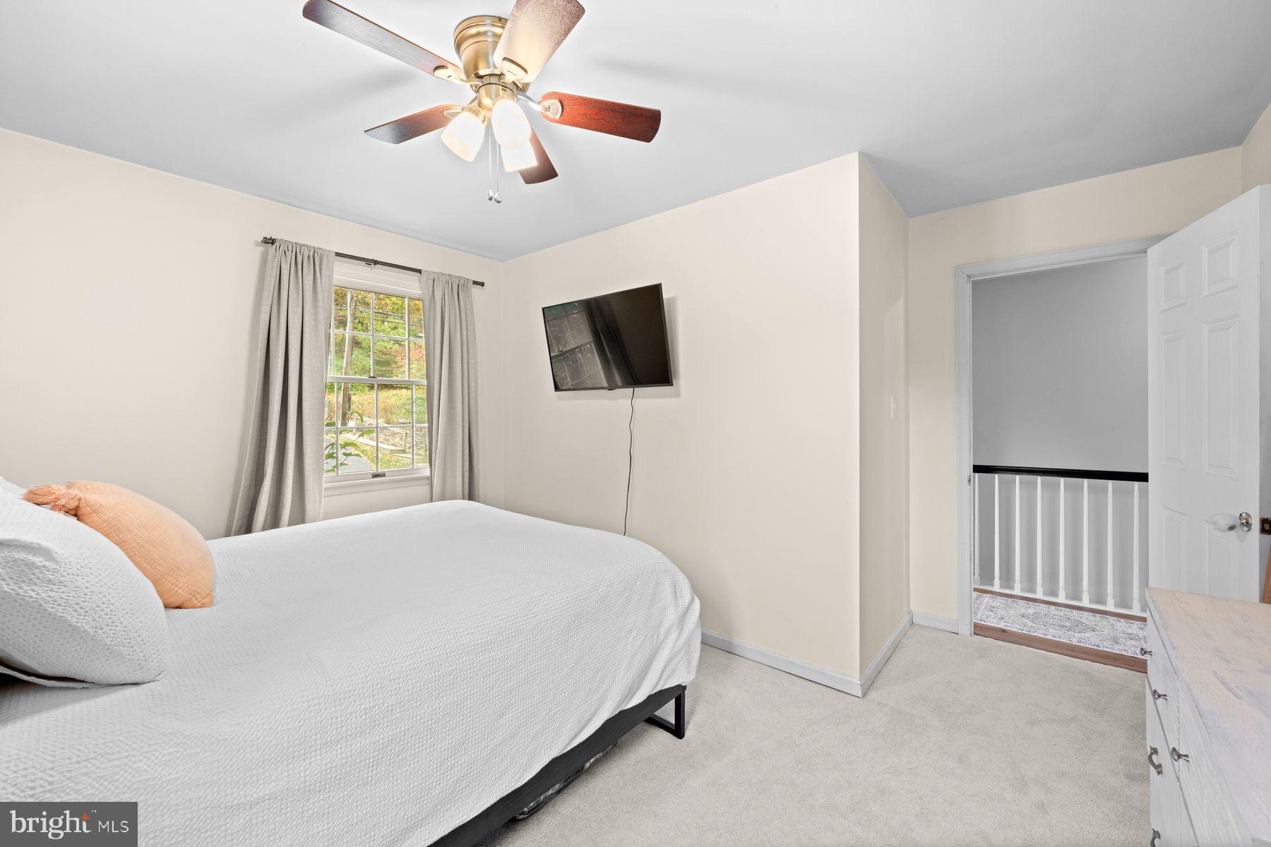 188 Arden Road Conshohocken, PA 19428 - Photo 22 of 39 a bedroom with a bed and a flat screen tv