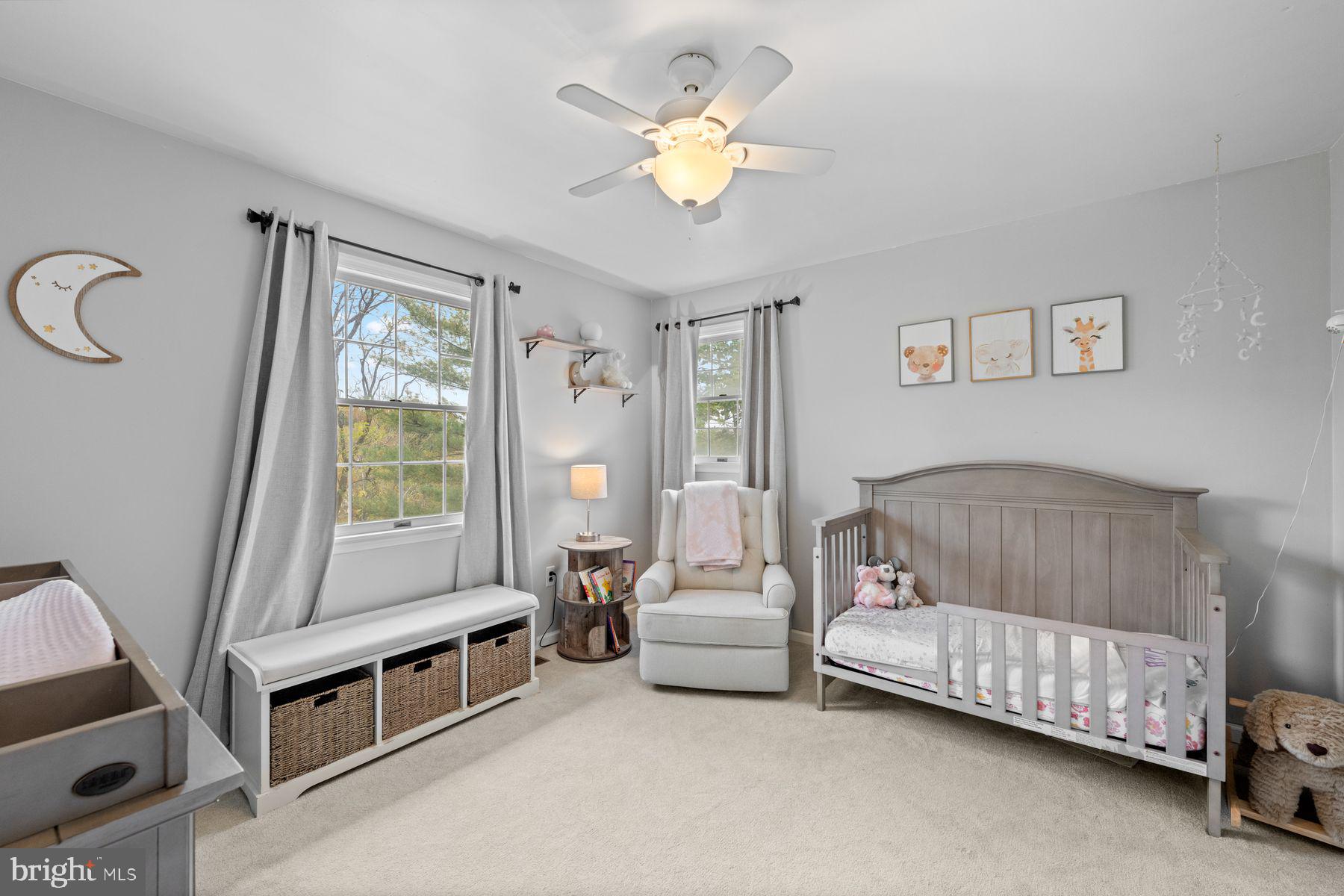 188 Arden Road Conshohocken, PA 19428 - Photo 23 of 39 a bedroom with a bed and a chandelier