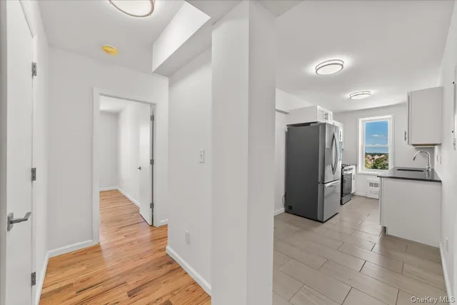 a kitchen with a refrigerator and a stove