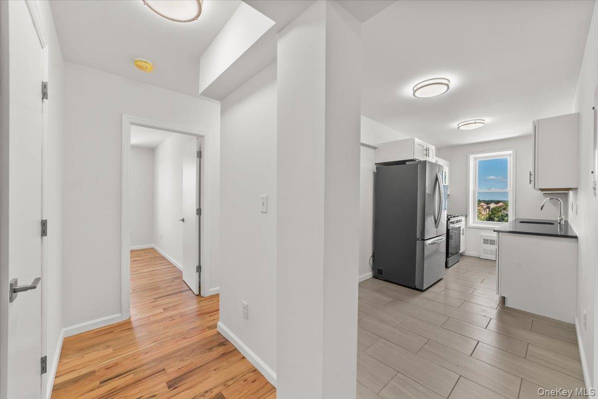 90 Union Street, Unit 6G New Rochelle, NY 10805 - Photo 11 of 20 a kitchen with a refrigerator and a stove