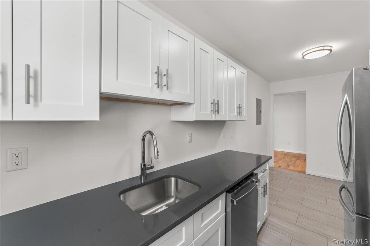 90 Union Street, Unit 6G New Rochelle, NY 10805 - Photo 13 of 20 a kitchen with granite countertop a sink a stove and refrigerator