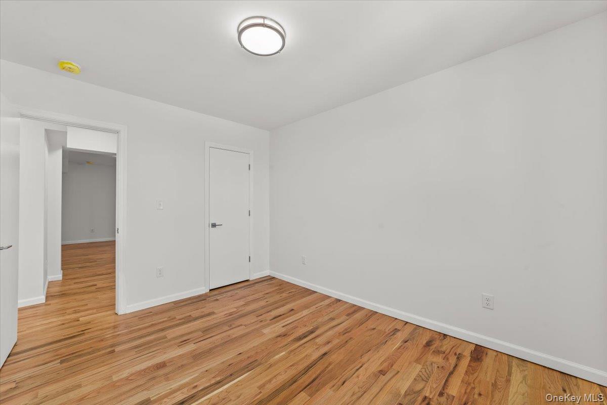 90 Union Street, Unit 6G New Rochelle, NY 10805 - Photo 17 of 20 a view of empty room with wooden floor