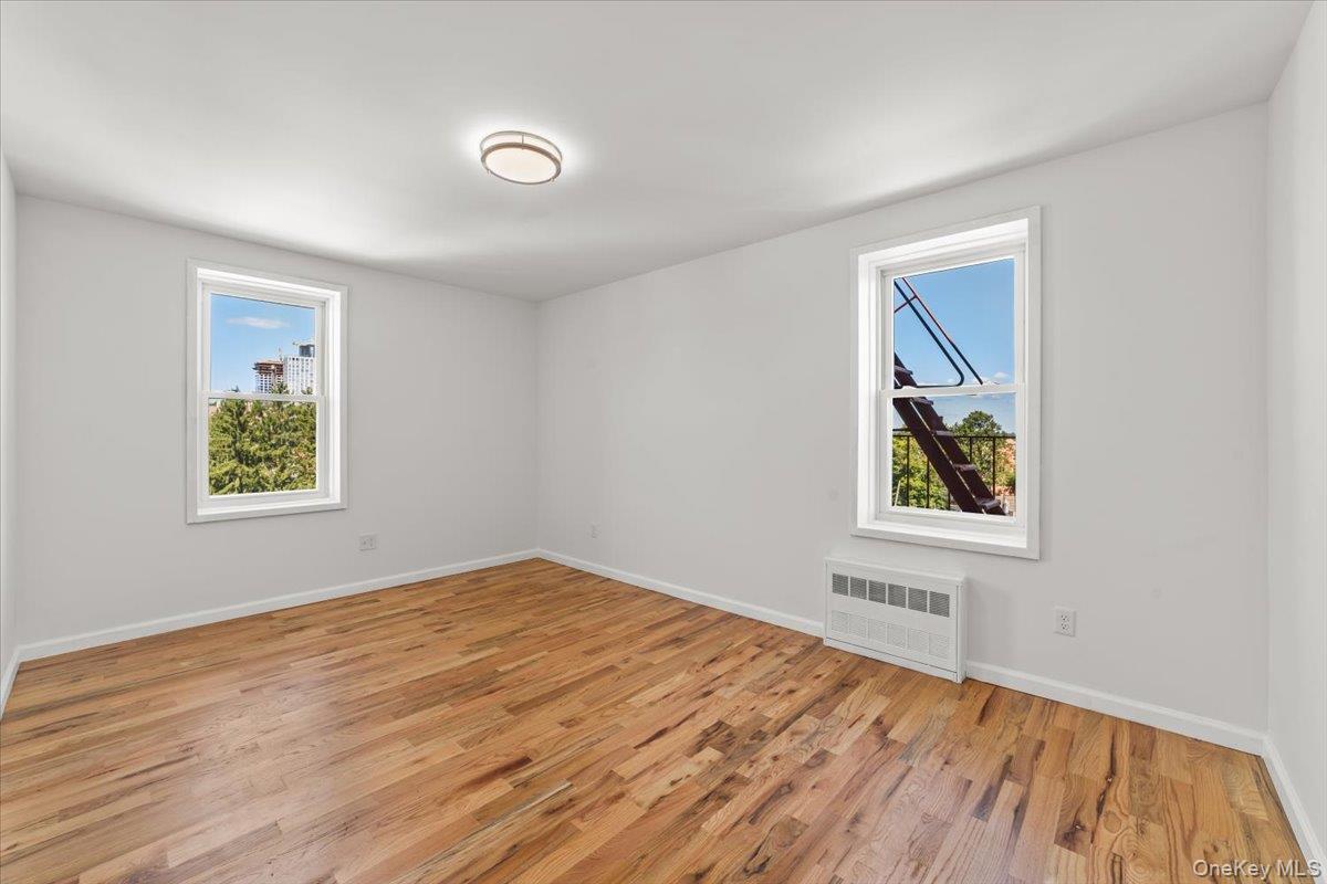 90 Union Street, Unit 6G New Rochelle, NY 10805 - Photo 18 of 20 a view of empty room with window and wooden floor