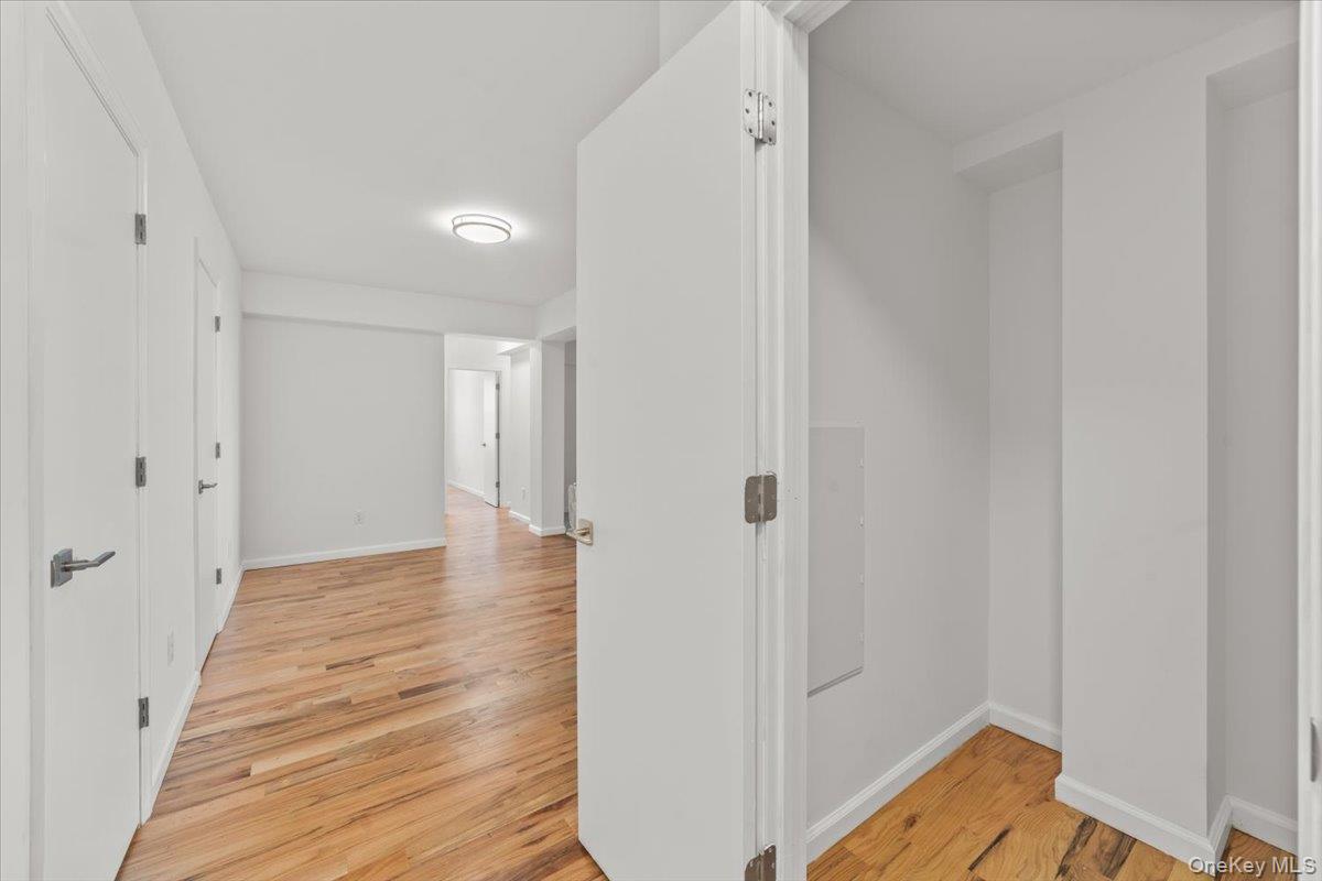90 Union Street, Unit 6G New Rochelle, NY 10805 - Photo 19 of 20 a view of a room with wooden floor and white walls