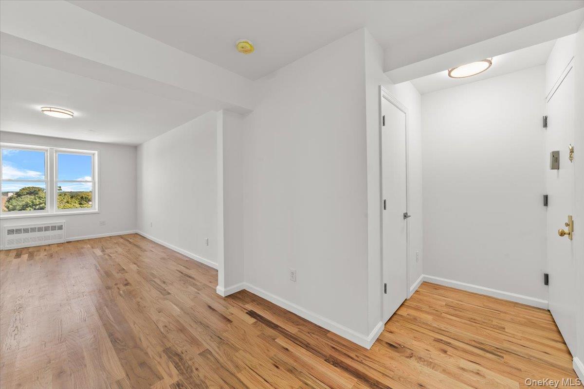 90 Union Street, Unit 6G New Rochelle, NY 10805 - Photo 9 of 20 a view of a room with wooden floor and window