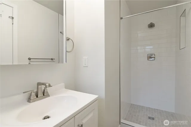 a bathroom with a sink and mirror