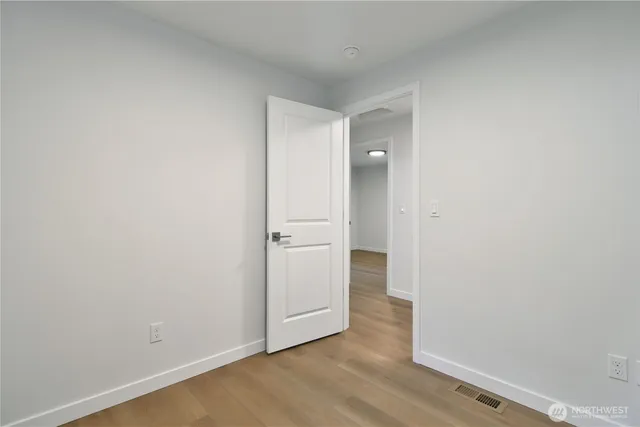 a view of a backyard with large trees