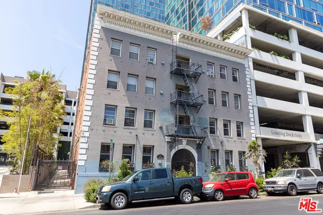 a front view of a building with parking space