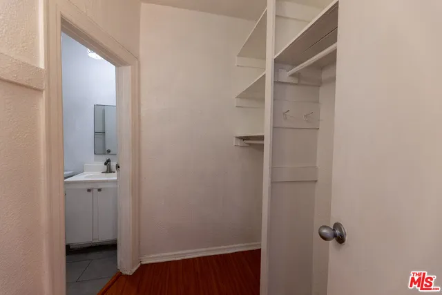 a view of room with wooden floor