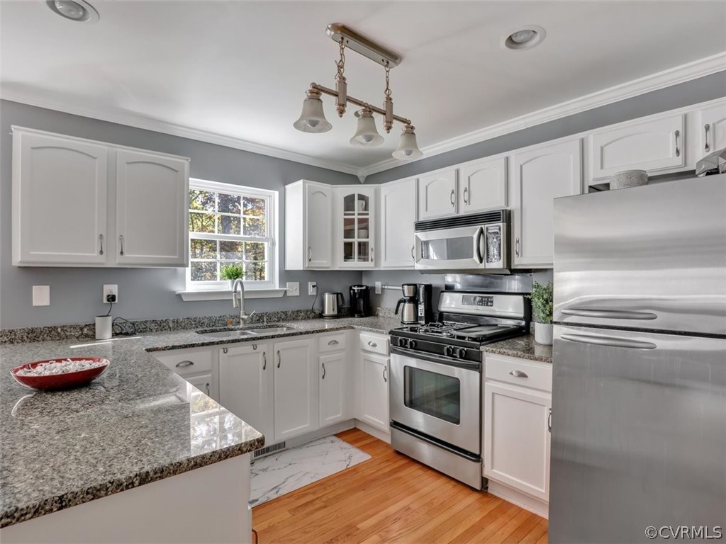 20037 Ivan Road Petersburg, VA 23803 - Photo 16 of 41 a kitchen with stainless steel appliances granite countertop a sink dishwasher stove top oven and cabinets