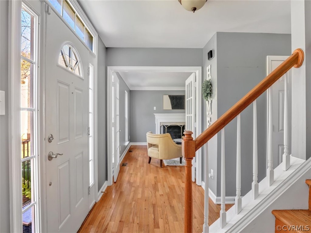 20037 Ivan Road Petersburg, VA 23803 - Photo 5 of 41 a view of a hallway with wooden floor and staircase