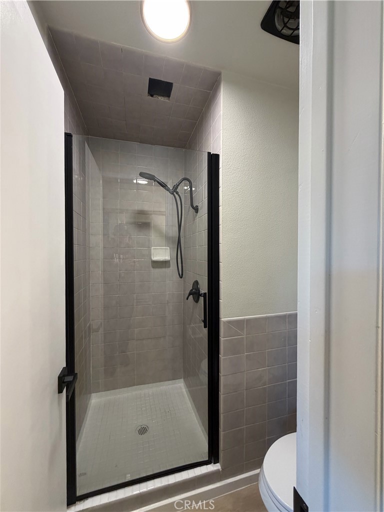 2579 Spring Meadow Lane Highland, CA 92346 - Photo 14 of 17 a bathroom with a shower and toilet