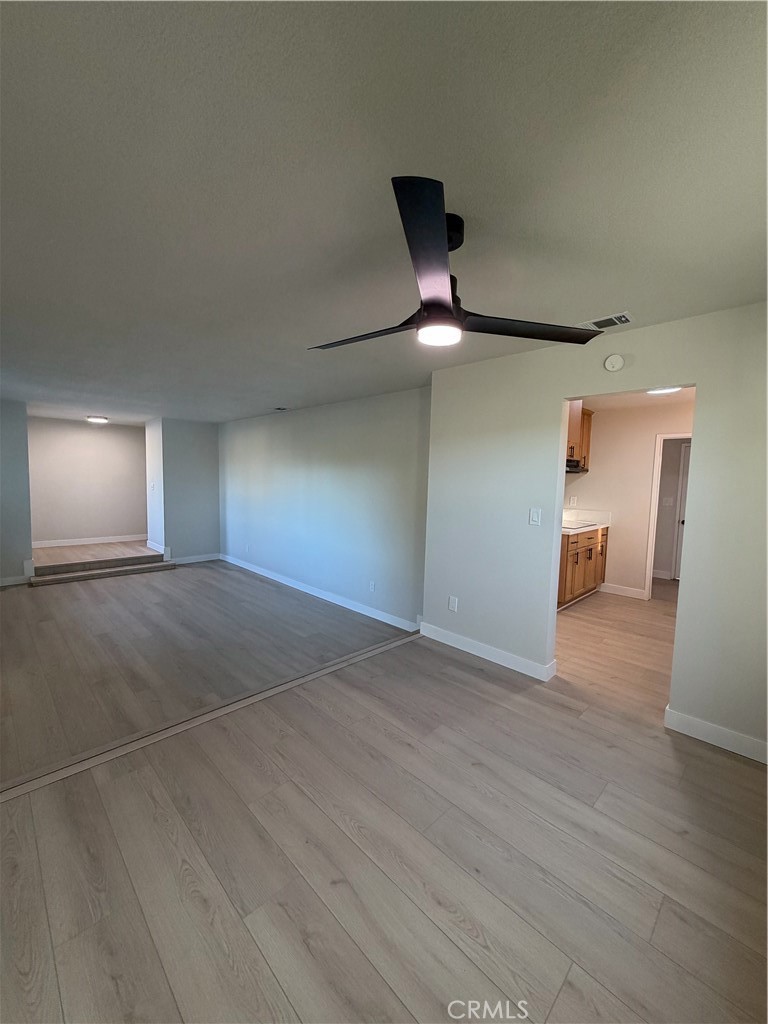 2579 Spring Meadow Lane Highland, CA 92346 - Photo 3 of 17 a view of empty room with wooden floor
