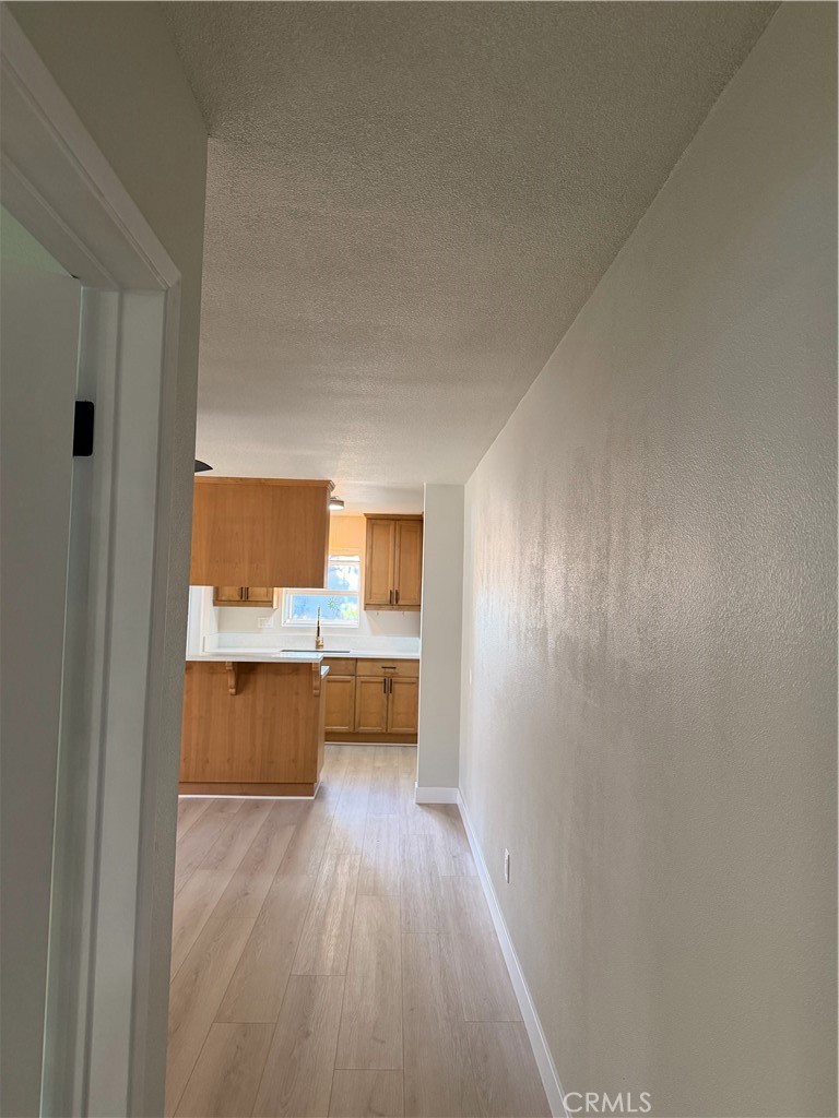 2579 Spring Meadow Lane Highland, CA 92346 - Photo 9 of 17 a view of room with wooden floor