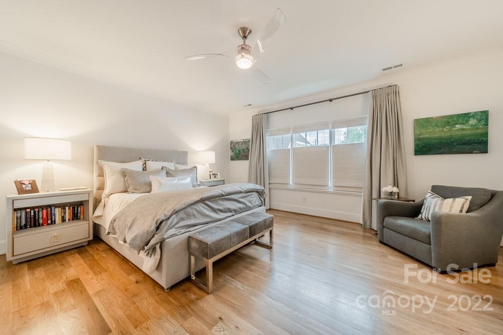 2801 Sharon Road Charlotte, NC 28211 - Photo 34 of 45 a spacious bedroom with a bed a couch and a window