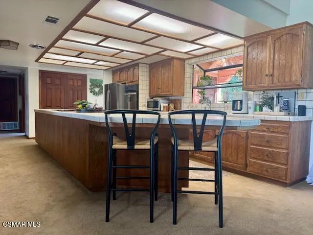 a view of a dining room with furniture and window