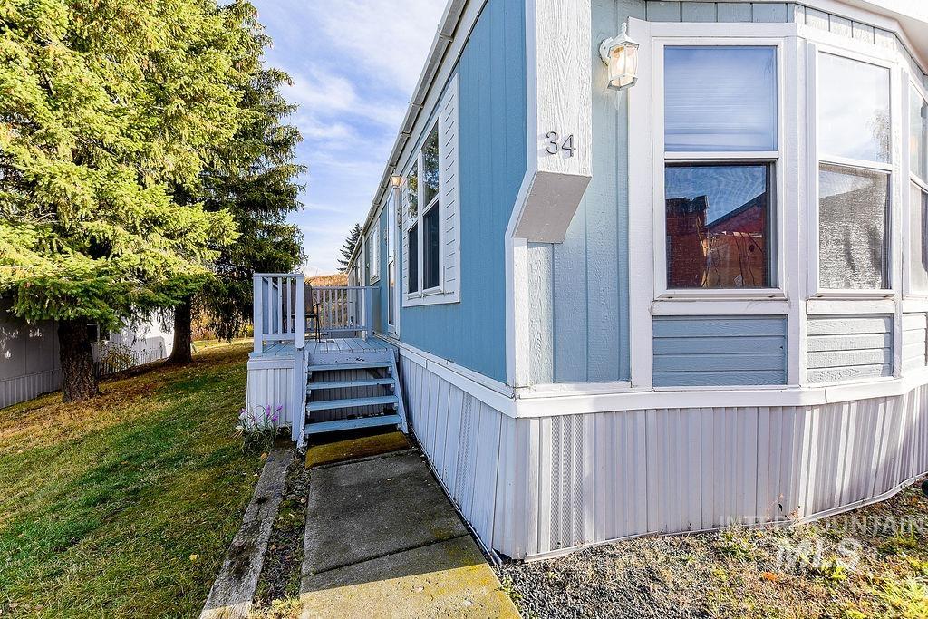 4325 Lenville Road, Unit 34 Moscow, ID 83843 - Photo 2 of 39 View of home's exterior featuring a yard
