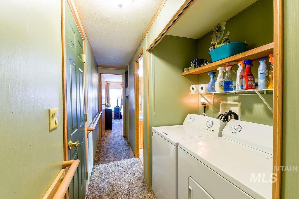 4325 Lenville Road, Unit 34 Moscow, ID 83843 - Photo 21 of 39 Laundry area with carpet, separate washer and dryer, and a textured ceiling