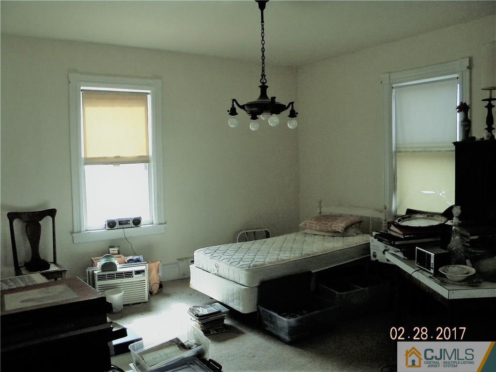 20 3rd Street Somerville, NJ 08876 - Photo 3 of 12 a bedroom with a bed and a window