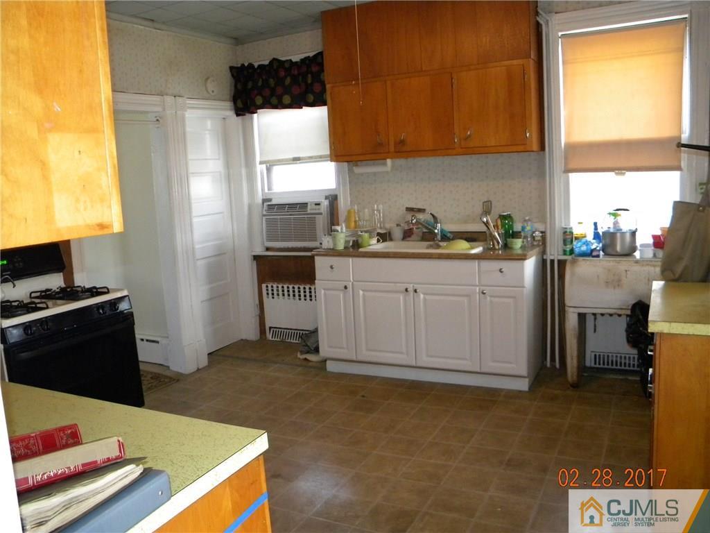 20 3rd Street Somerville, NJ 08876 - Photo 4 of 12 a kitchen with sink cabinets and appliances
