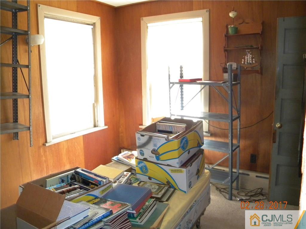 20 3rd Street Somerville, NJ 08876 - Photo 8 of 12 a bedroom with a bed and a window