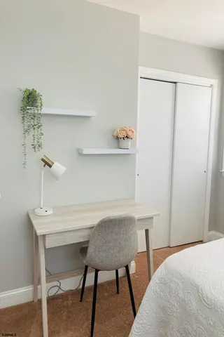 a bedroom with a bed and a table in it