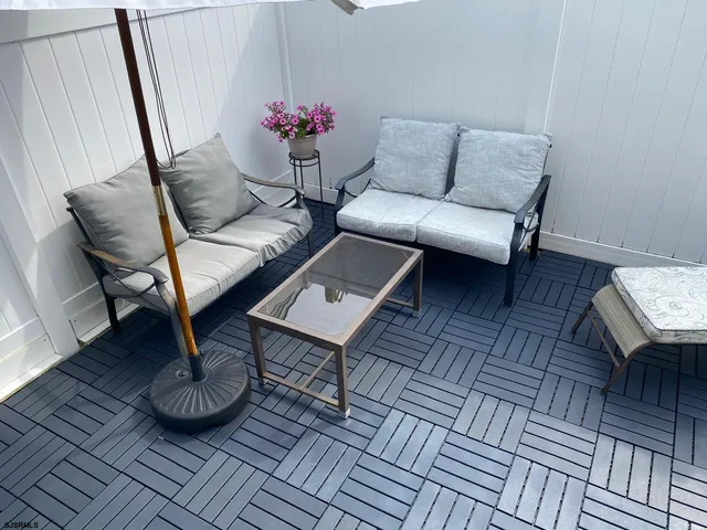 a living room with furniture and a rug