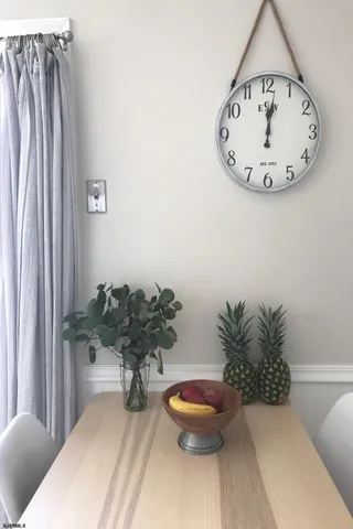 a view of a room with a table and a potted plants