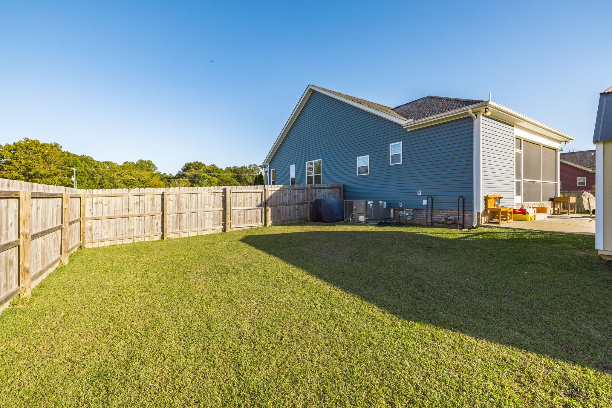 324 East Biggs Road Portland, TN 37148 - Photo 16 of 57 a view of an house with backyard and patio