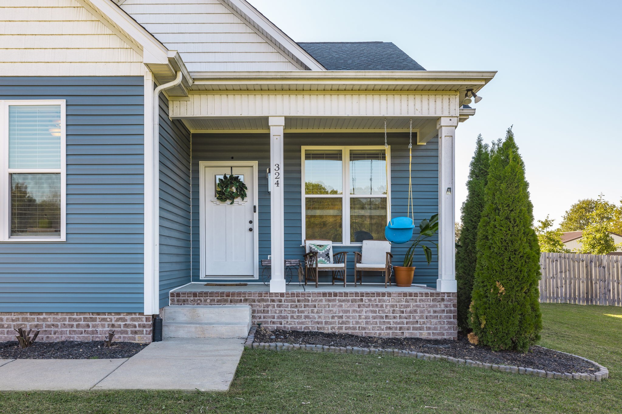 324 East Biggs Road Portland, TN 37148 - Photo 3 of 57 a front view of a house with a garden