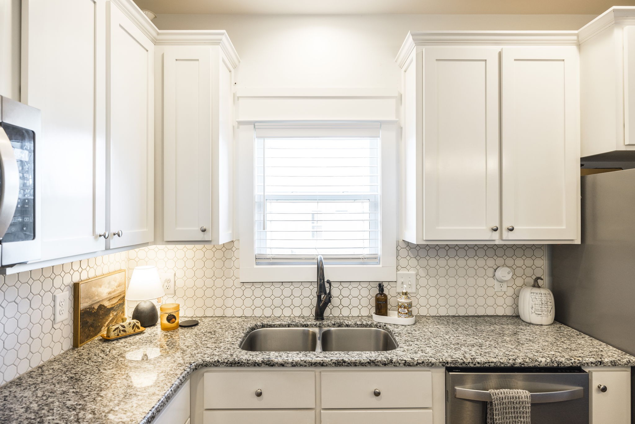 324 East Biggs Road Portland, TN 37148 - Photo 43 of 57 a kitchen with granite countertop a sink window and cabinets