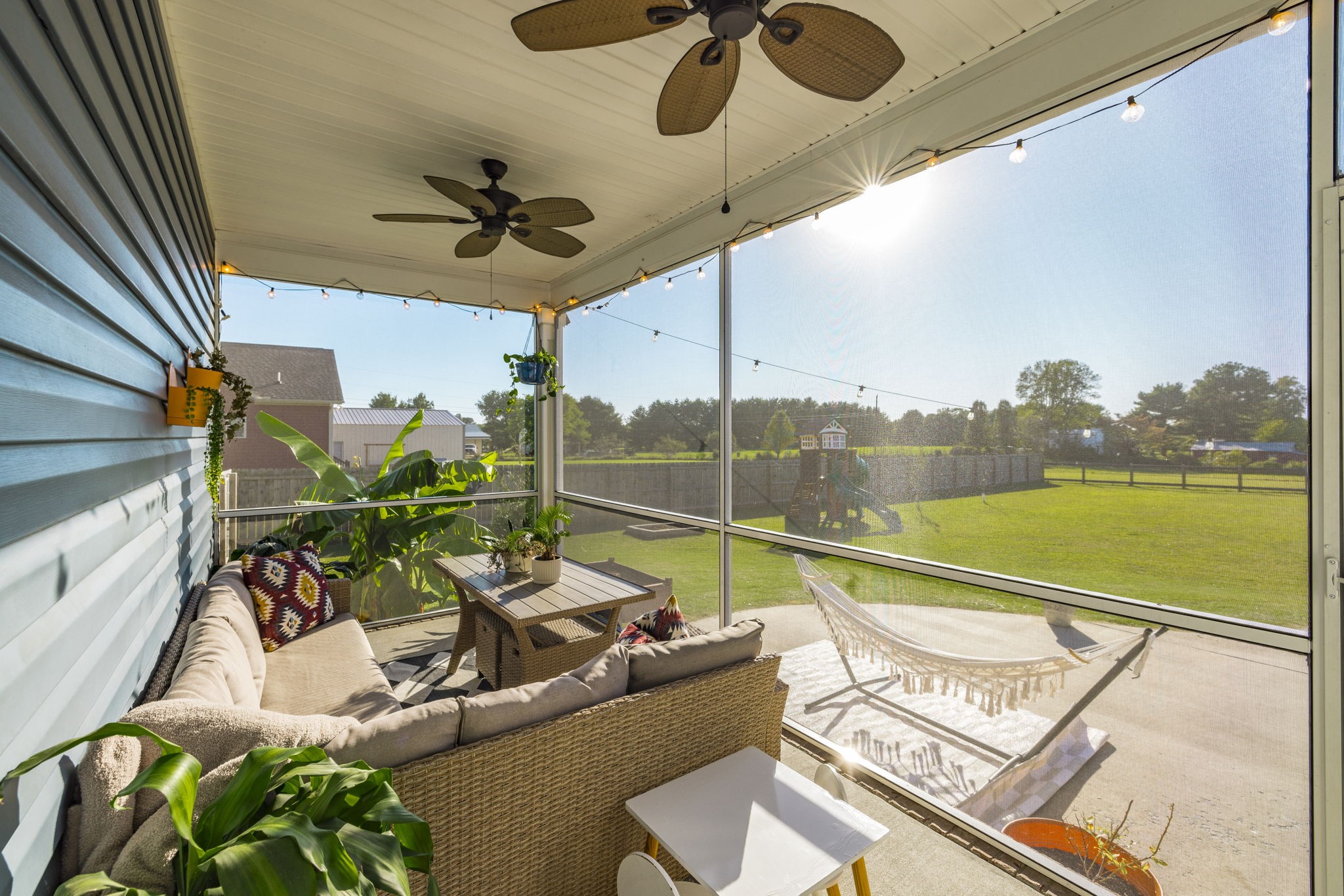 324 East Biggs Road Portland, TN 37148 - Photo 7 of 57 a view of a balcony with couches chairs and potted plants