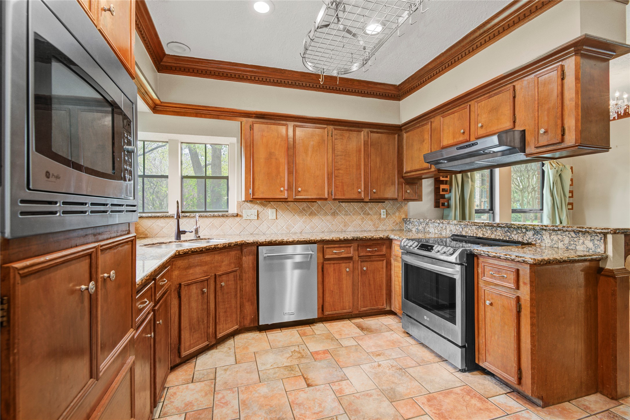 8412 Hidden Trail Lane Spring, TX 77379 - Photo 10 of 43 Just off the dining room, the spacious kitchen features abundant cabinetry, generous counter space, and an efficient layout ideal for everyday cooking and entertaining.
