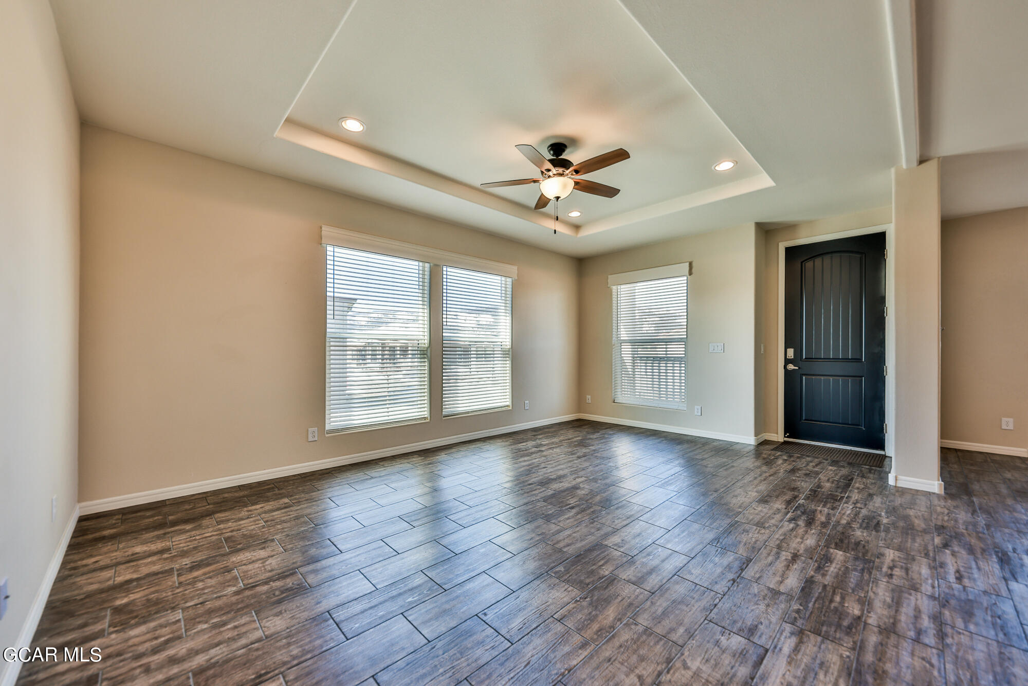 551 Summit Trail, Unit 145 Granby, CO 80446 - Photo 11 of 39 a view of an empty room with a window and wooden floor