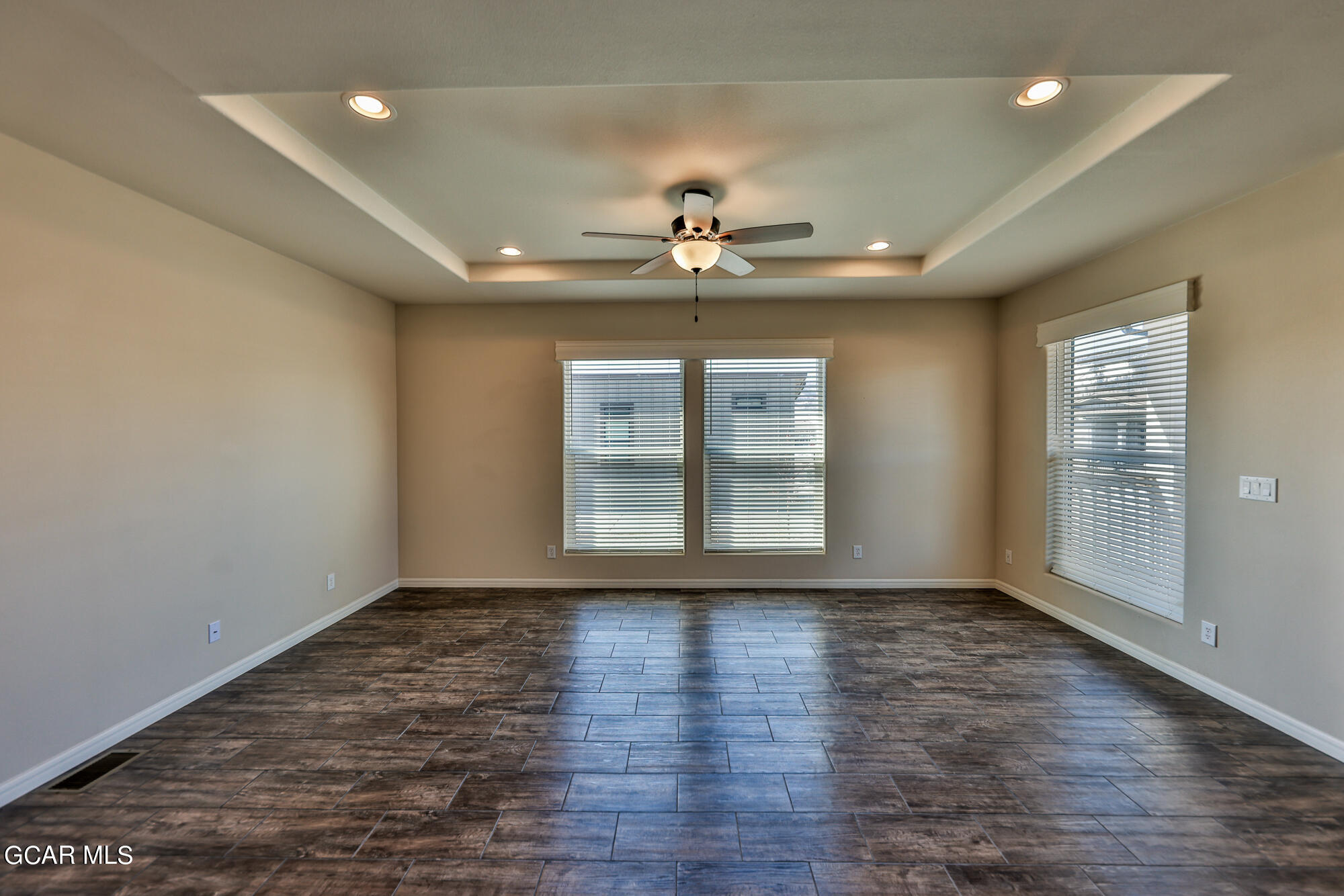 551 Summit Trail, Unit 145 Granby, CO 80446 - Photo 13 of 39 a view of an empty room with a window and wooden floor