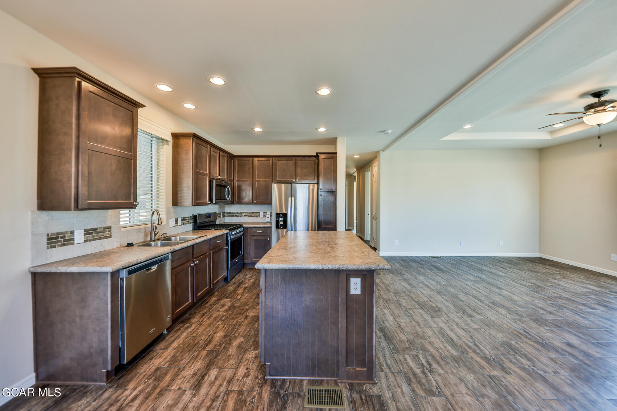 551 Summit Trail, Unit 145 Granby, CO 80446 - Photo 20 of 39 a kitchen with stainless steel appliances granite countertop a sink stove and refrigerator