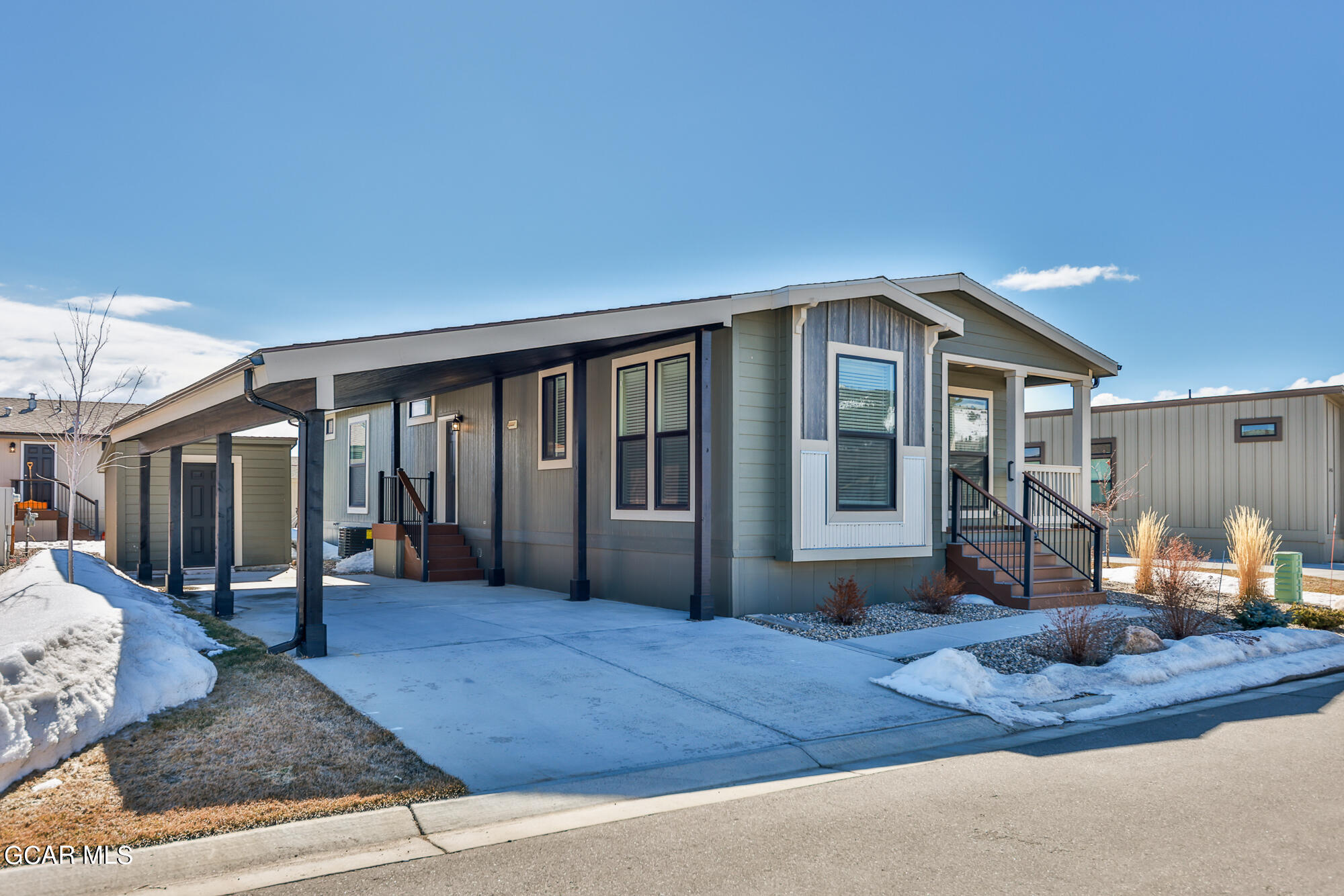 551 Summit Trail, Unit 145 Granby, CO 80446 - Photo 2 of 39 a front view of a house with garden