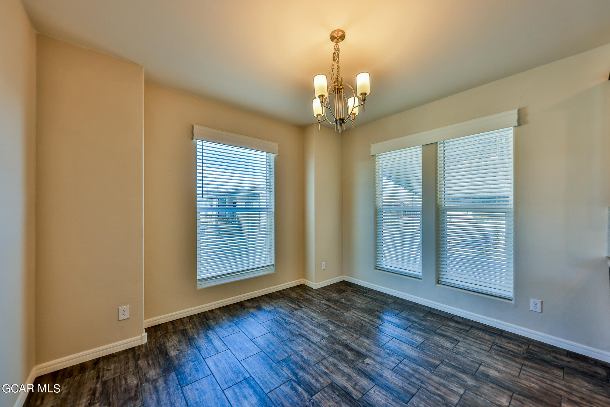 551 Summit Trail, Unit 145 Granby, CO 80446 - Photo 23 of 39 a view of an empty room with a window and wooden floor