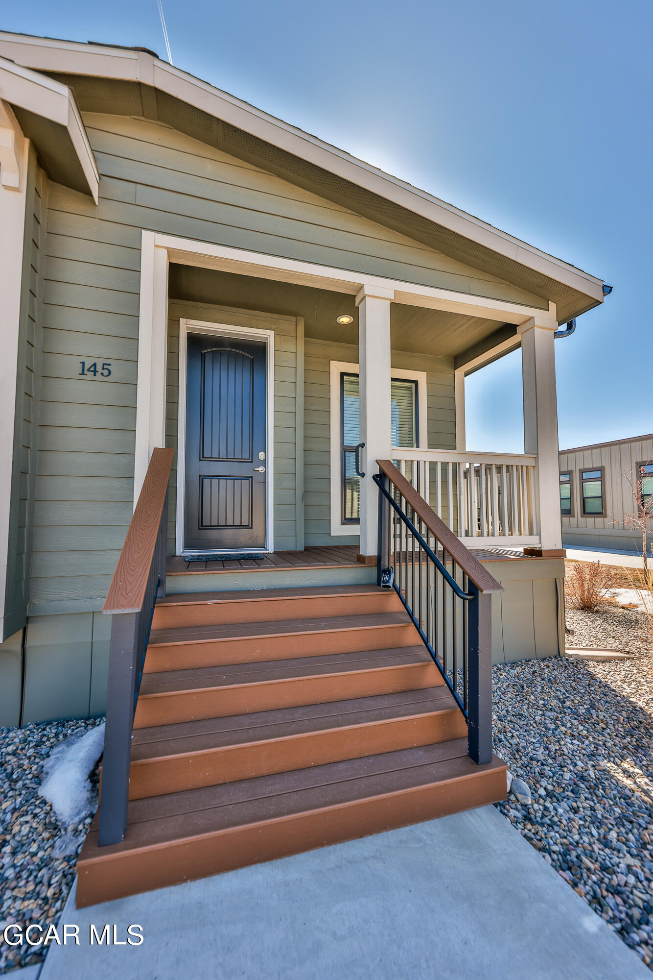 551 Summit Trail, Unit 145 Granby, CO 80446 - Photo 5 of 39 a view of a house with a porch