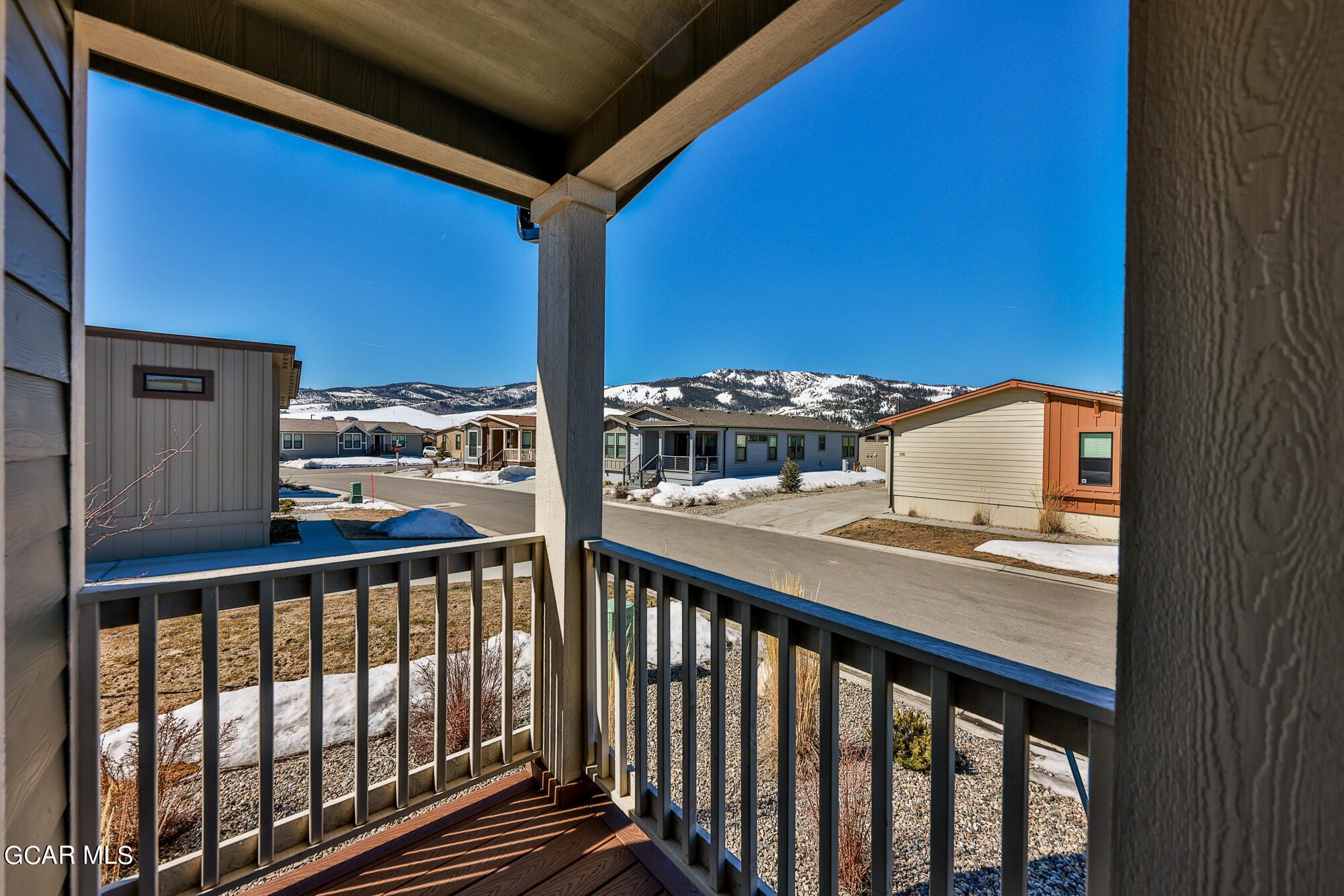 551 Summit Trail, Unit 145 Granby, CO 80446 - Photo 7 of 39 a view of balcony with two chairs and fence