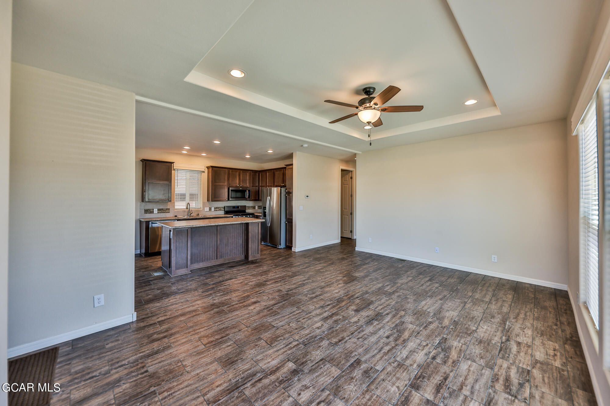 551 Summit Trail, Unit 145 Granby, CO 80446 - Photo 10 of 39 a view of kitchen with granite countertop cabinets and refrigerator