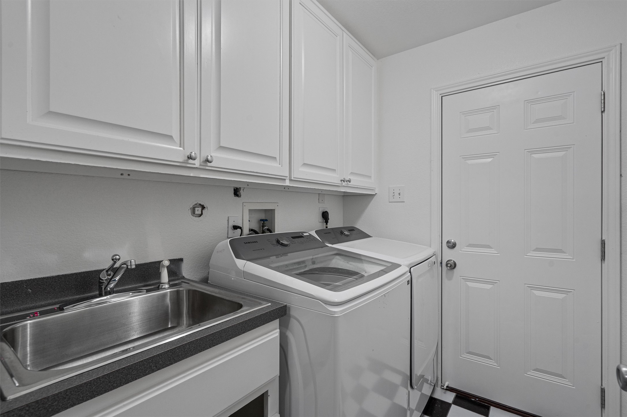 130 Cotton Rows Lane Taylor, TX 76574 - Photo 20 of 32 a kitchen with a sink and cabinets