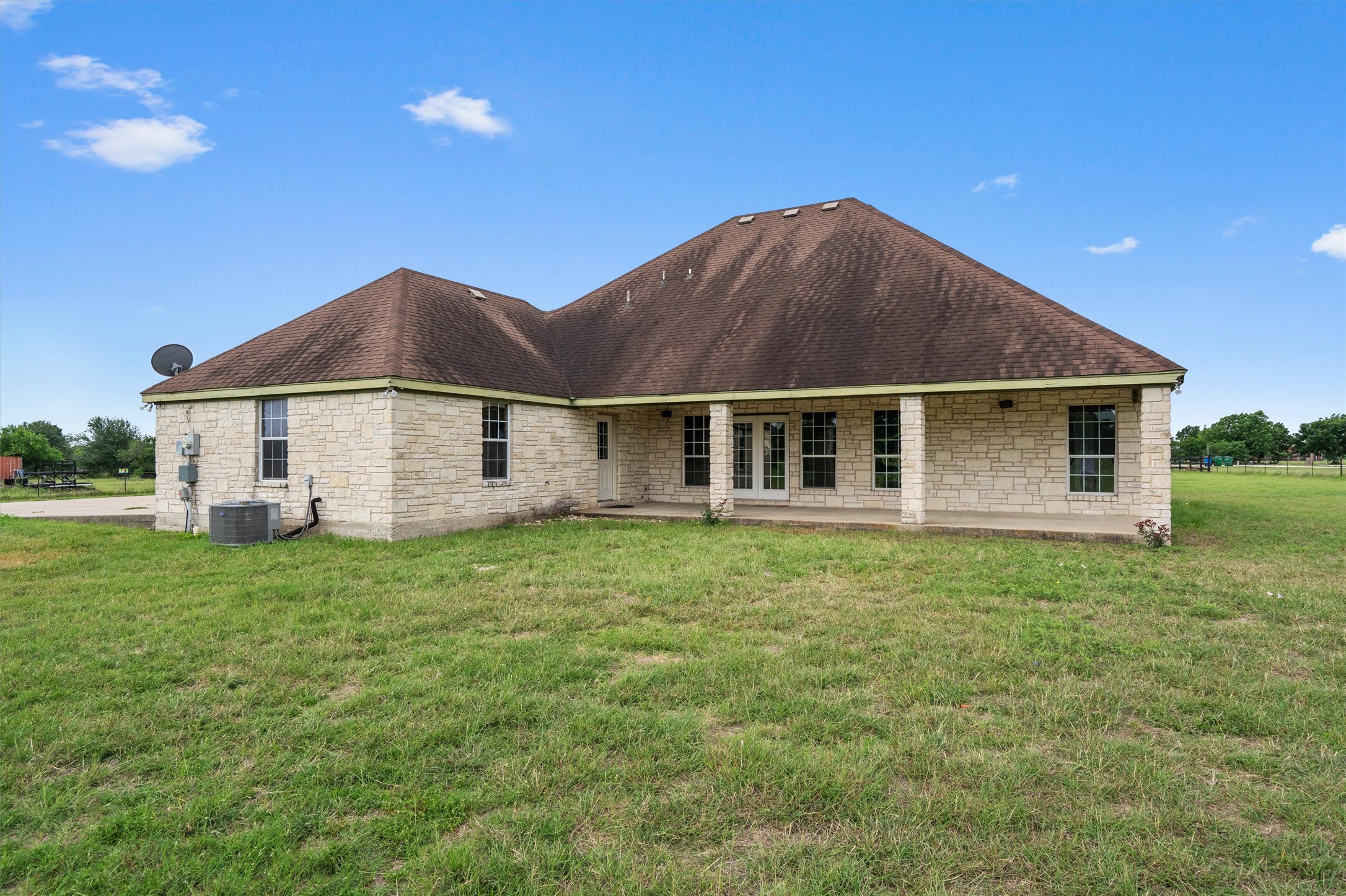 130 Cotton Rows Lane Taylor, TX 76574 - Photo 7 of 32 a house with green field in front of it